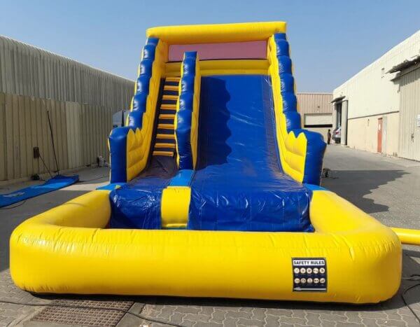 Rent our inflatable water slide for your next party or event, featuring a fun and colorful design and a twisting slide that ends in a splash pool.
